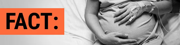 Pregnant patient cradling her stomach in a hospital bed with a text callout of the word FACT