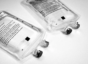 Two nondescript 100 mL IV bags.