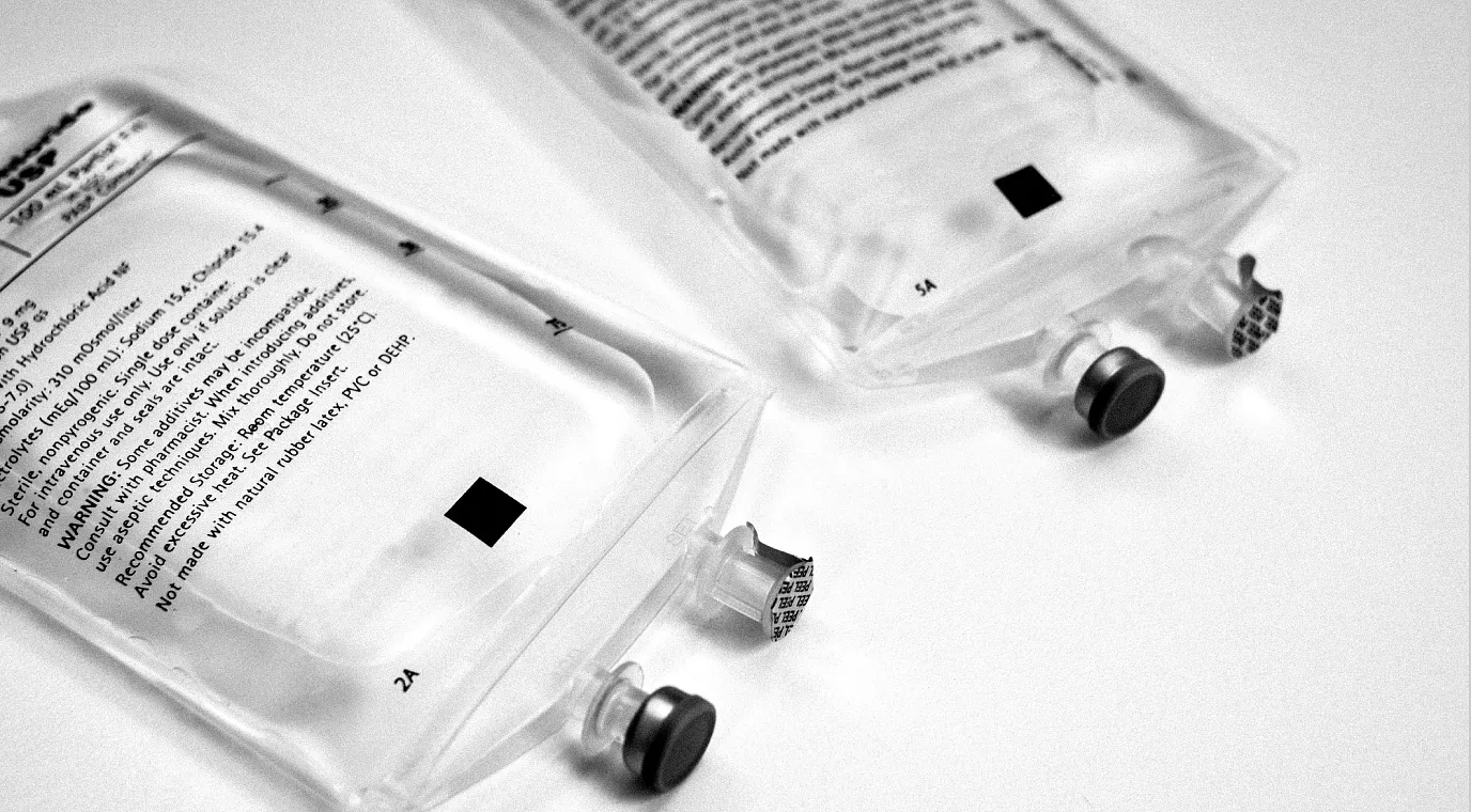 Two nondescript 100 mL IV bags.